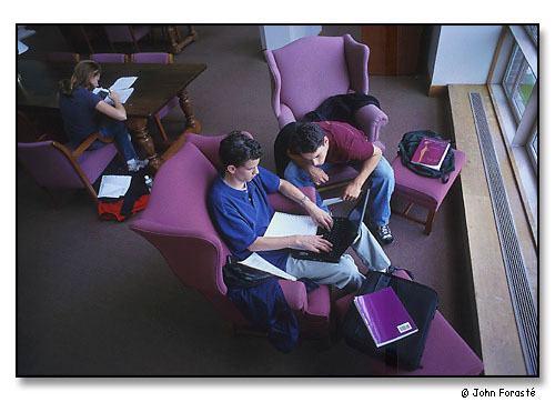 Students working together in library with laptop. <br>Main Room, Olin Memorial Library, Wesleyan University, Middletown, Connecticut. September 2000.