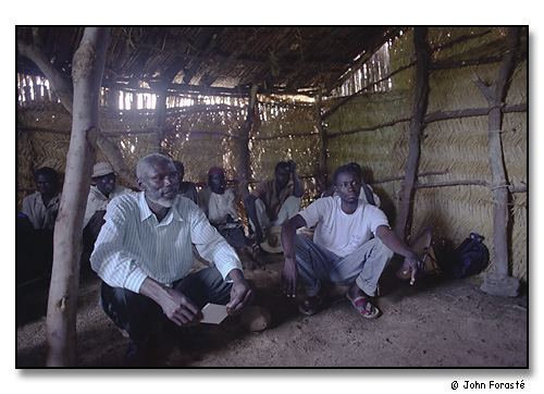 Meeting with village men in mountain school, above Mora, Cameroon, Africa