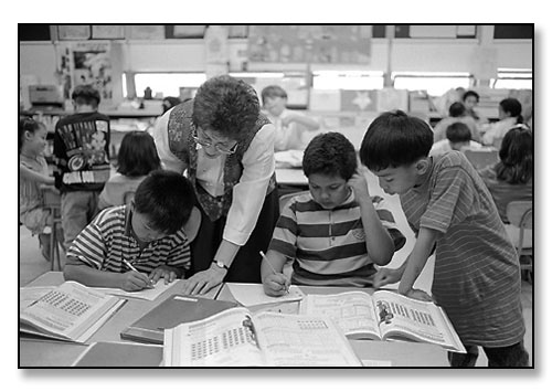 Rosemarie Manson's busy 3rd grade class. <br>Camden Avenue School, Providence, Rhode Island. May 1994.