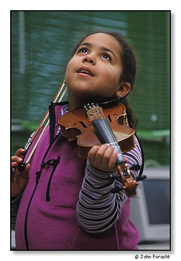 >Stephanie Del Carmen, a Community MusicWorks' student during violin lesson. <br>The West End Community Center, Providence, Rhode Island. April 2002.