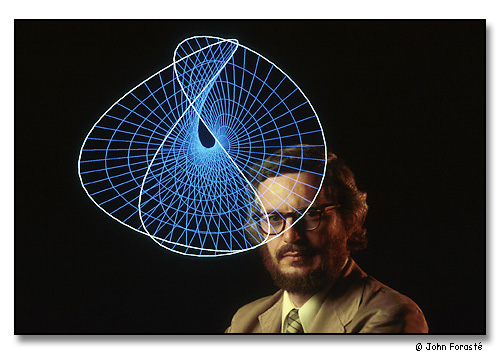 Tom Banchoff, Professor of Mathematics, researches the fourth dimension. <br>Double exposure with computer image that was mathematically generated by Banchoff. <br>Photograph made for Notre Dame alumni magazine.<br>Brown University, Providence, Rhode Island. August 1980