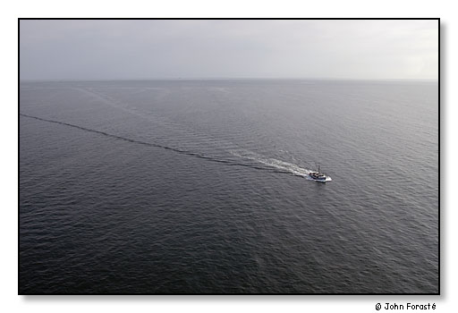 Fishing boat and open water from the air. <br>Photograph made for America 24/7 project. <br>Just off Newport, Rhode Island (Rhode Island Sound looking out to the Atlantic Ocean). May 2003.