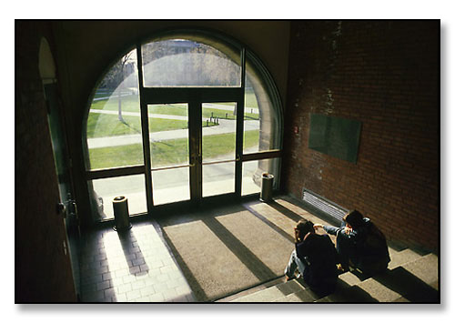 College students chatting on a late spring afternoon. <br>Wilson Hall foyer, Brown University, Providence, Rhode Island. April 1979.