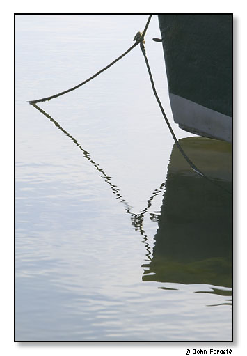 Detail of small boat, lines and water. Salt Pond, Cape Cod National Seashore, Massachusetts. September 2004.