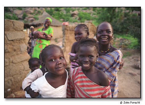 Laughing girls. <br>Mora, Cameroon, (central west) Africa. August 2002.